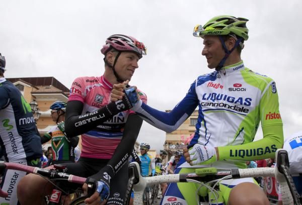Ryder Hesjedal (Garmin - Barracuda) and Ivan Basso begin stage 9 with a thumb war