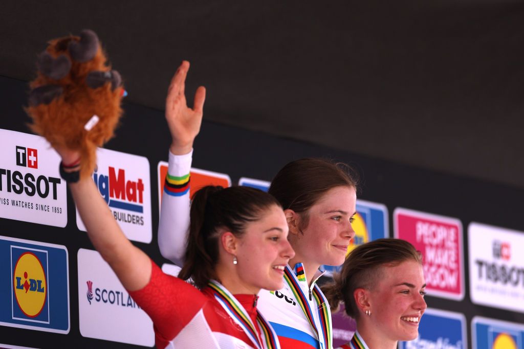 GLENTRESS FOREST PEEBLES SCOTLAND AUGUST 10 Gold medalist Isabella Holmgren of Canada C celebrates winning during the medal ceremony after the at the 96th UCI Cycling World Championships Glasgow 2023 Day 8 UCIWT on August 10 2023 in Glentress Forest Peebles Scotland Photo by Dean MouhtaropoulosGetty Images