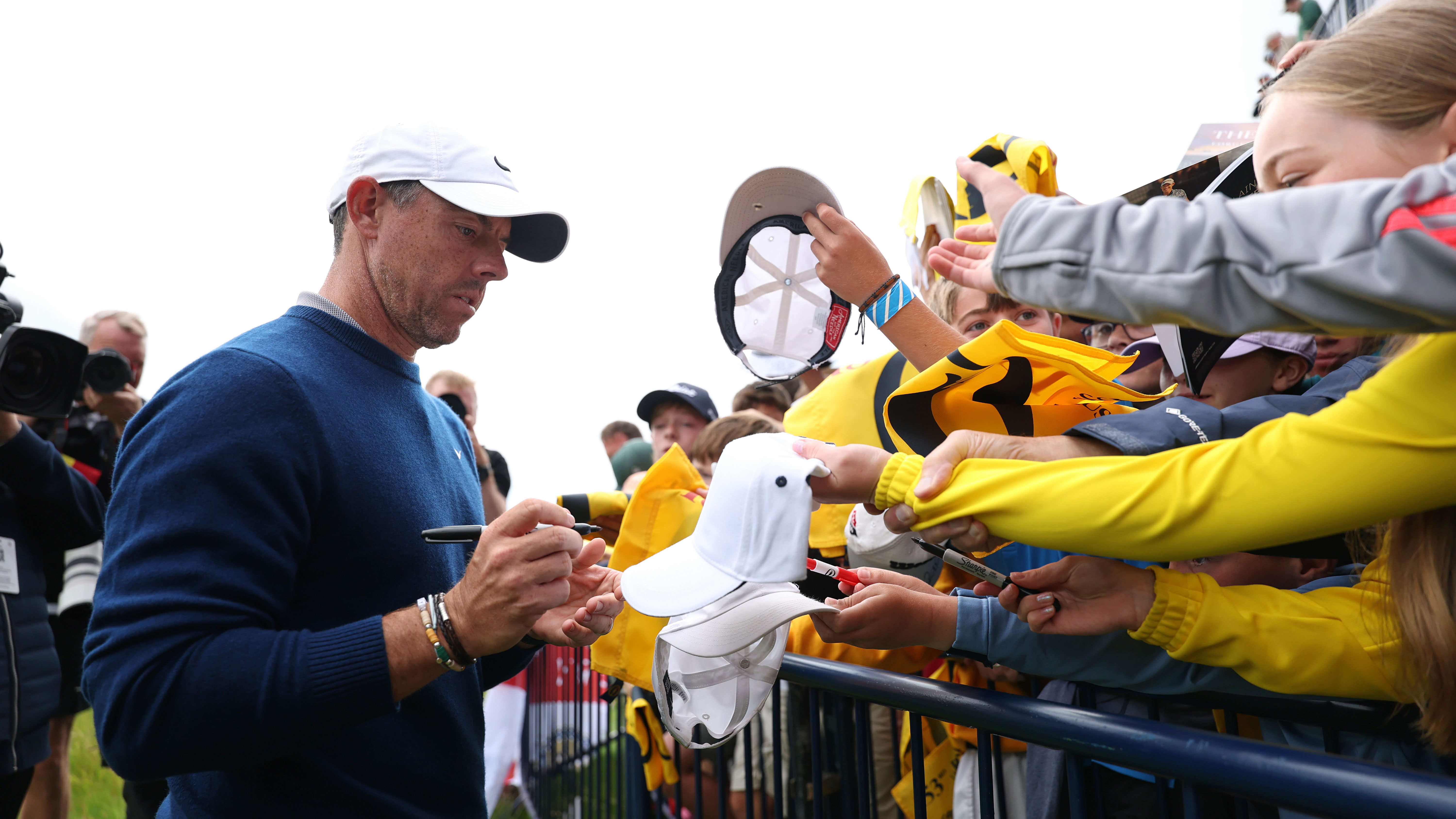 Rory McIlroy signs autographs for fans at Royal Portrush