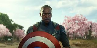 anthony mackie in the captain america suit holding the shield in dc in a still from captain america brave new world