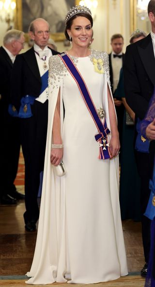 Catherine, Princess of Wales wears a white, silver embellished Jenny Packham gown during the State Banquet at Buckingham Palace on November 22, 2022 in London, England.