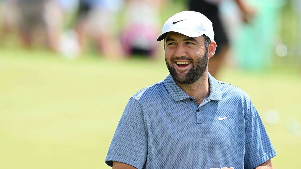 Scottie Scheffler smiles on the practice putting green during a practice round prior to the 2024 PGA Championship at Valhalla Golf Club on May 13, 2024 in Louisville, Kentucky.