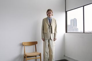 Utilitarian and Workwear-inspired S/S 2024 Men’s Fashion photographed against white wall