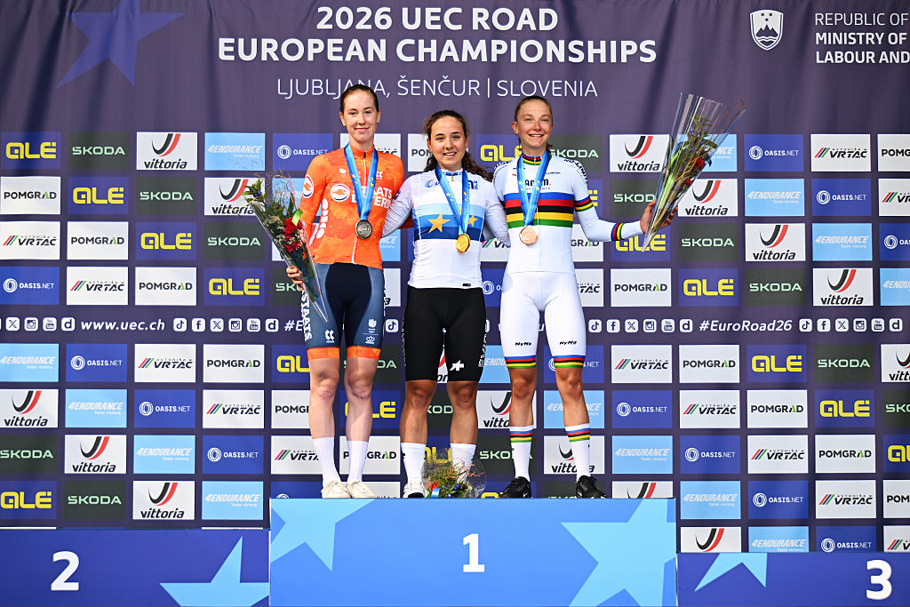 Gold medalist Mara Winter, Silver medalist Nienke Vinke and Team Netherlands, and Bronze medalist Viktoria Chladonova pose on the podium during the 32nd UEC Road Cycling European Championships 2026