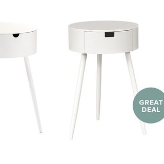 white wooden bedside table with three legs