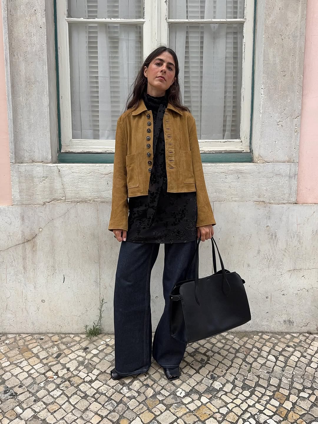 woman wearing fall dark denim trend 2025
