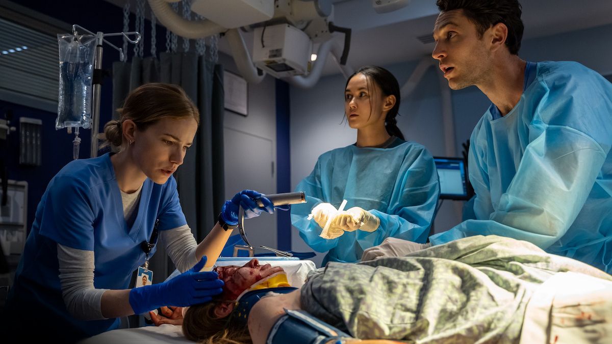 Danny (Willa Fitzgerald) and other doctors examining a trauma patient in Netflix's "Pulse."