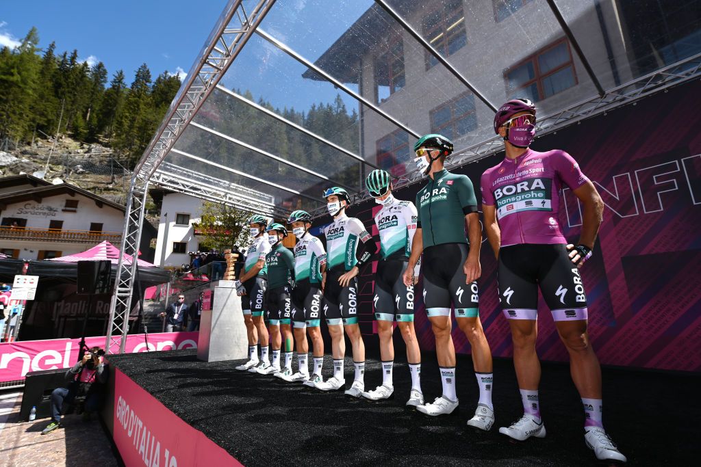 SEGA DI ALA ITALY MAY 26 Peter Sagan of Slovakia Giovanni Aleotti of Italy Purple Points Jersey Cesare Benedetti of Italy Maciej Bodnar of Poland Matteo Fabbro of Italy Felix Groschartner of Austria Daniel Oss of Italy and Team Bora Hansgrohe at start in Canazei Village during the 104th Giro dItalia 2021 Stage 17 a 193km stage from Canazei to Sega di Ala 1246m Mask Covid safety measures Team Presentation UCIworldtour girodiitalia Giro on May 26 2021 in Sega di Ala Italy Photo by Stuart FranklinGetty Images
