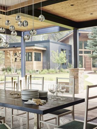 Outdoor dining space with chandelier