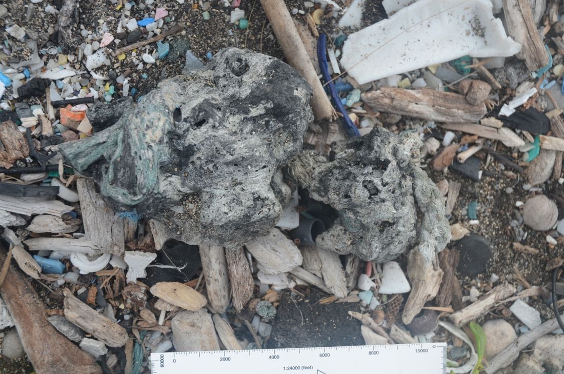 image of plastiglomerate rock material on hawaii&#039;s kamilo beach.