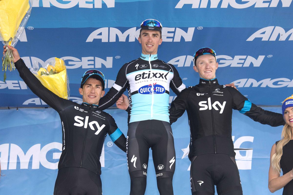 Julian Alaphilippe (Etixx-Quickstep) is flanked by Sergio Henao (left) and Ian Boswell (right)