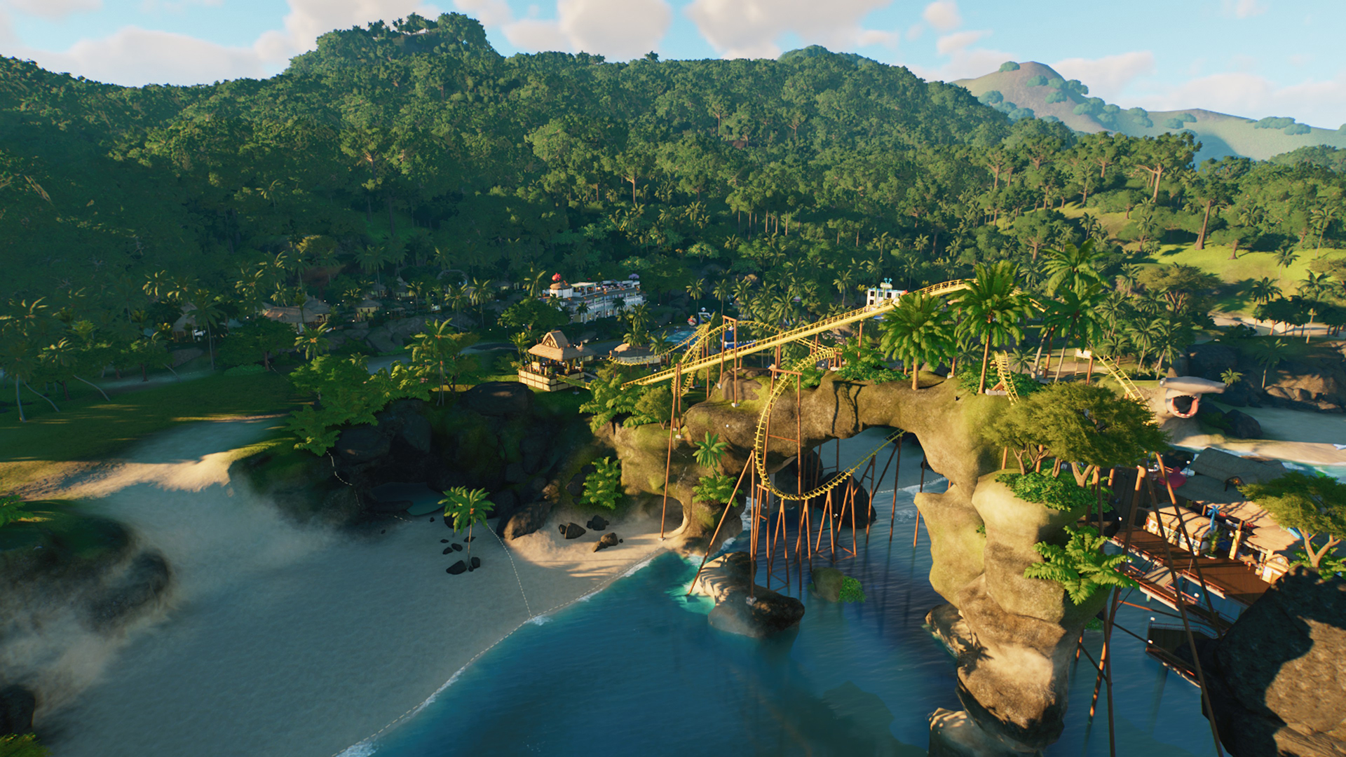 A seaside cove with a rollercoaster running through an arch in the rock.