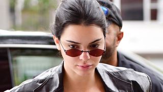 Kendall Jenner wearing small sunglasses.