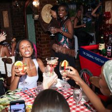 women toasting drinks at a marie claire party