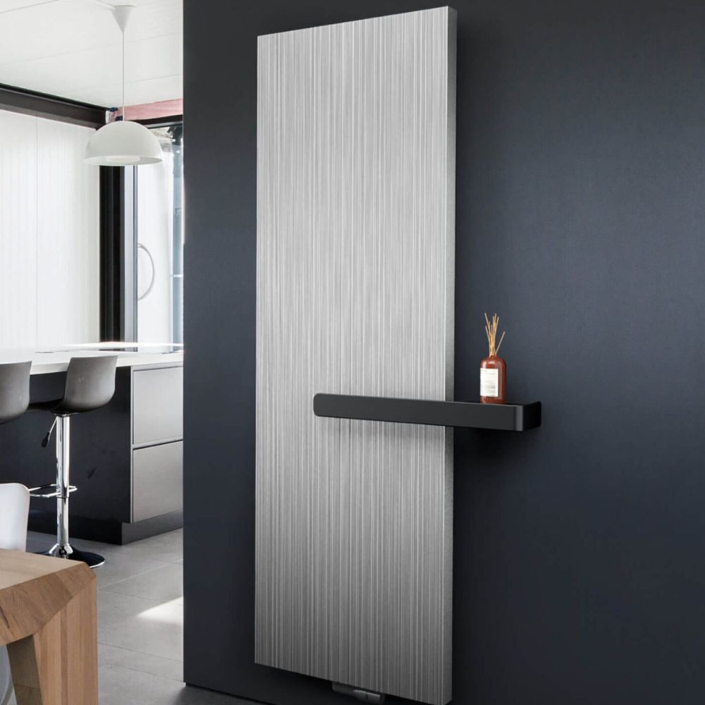 Contemporary radiator with a black floating shelf. This radiator shelf idea adds both heat efficiency and modern design appeal.