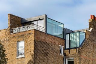 glass box extensions on top of a house