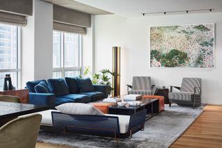 A living room with velvet sofa