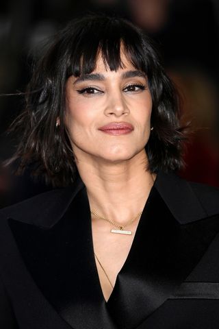 Sofia Boutella is pictured with a wavy bob and full fringe at the "Rebel Moon – Part Two: The Scargiver" UK Special Screening at The Curzon Mayfair on April 16, 2024 in London, England.