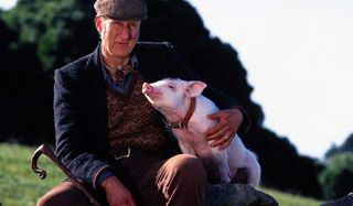 Babe James Cromwell farmer hugs his pig