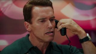 Arnold Schwarzenegger looks worried on the phone in Jingle All The Way.