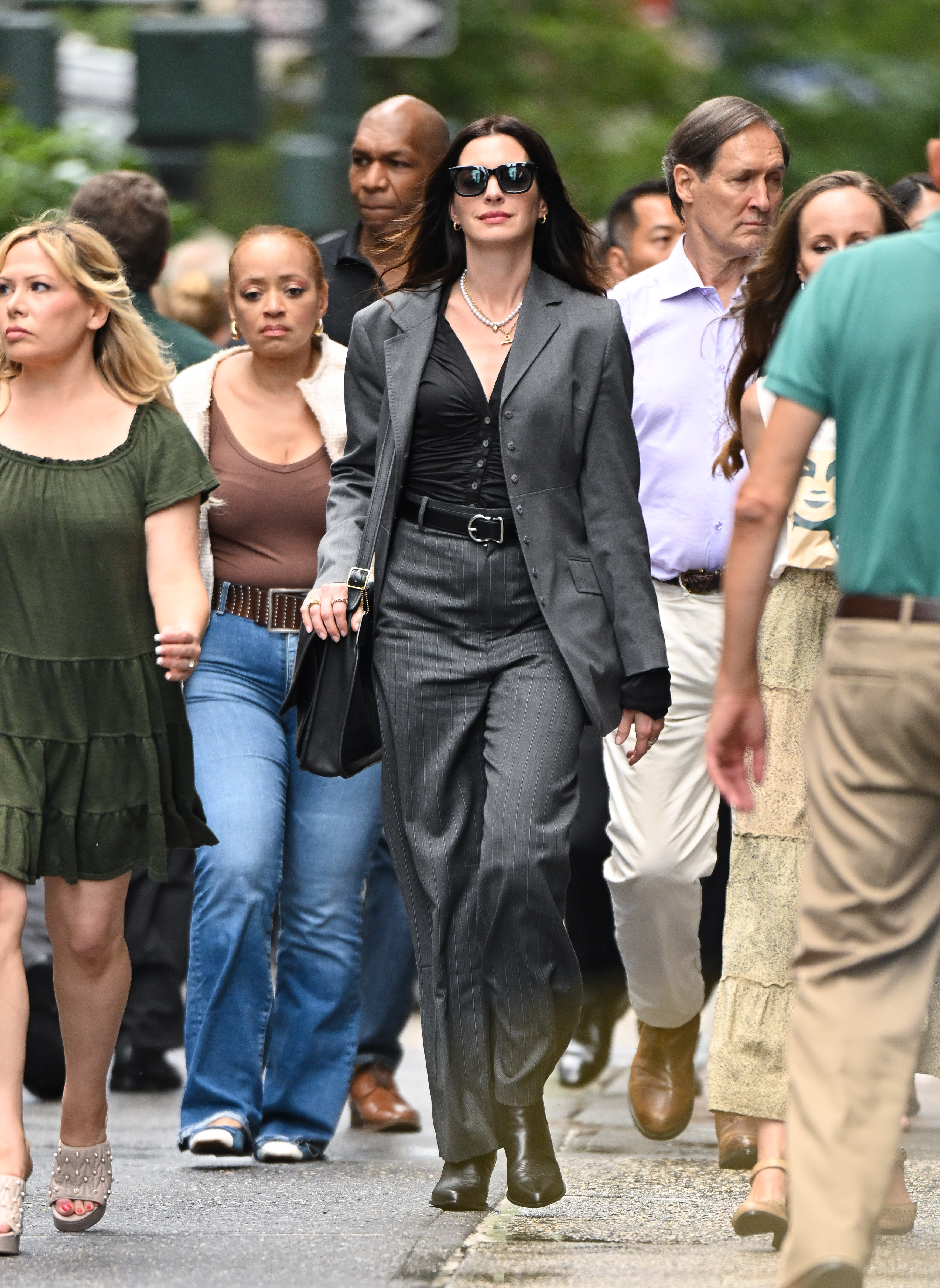 Anne Hathaway styled a gray suit set on the Devil Wears Prada 2 set