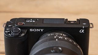 The Sony ZV-E1 camera sitting on a wooden table