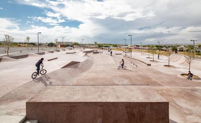 Pink concrete skatepark in action