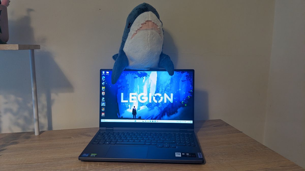 The Lenovo Legion 5i (2022) gaming laptop on a wooden desk.