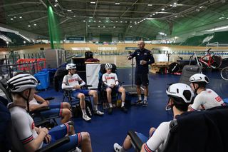 Stuart Blunt talking to Team GB riders in Manchester Velodrome