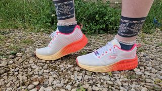 Fitness writer Lou Mudge modles the Skechers Max Cushioning Elite Speed Play on a gravel path.