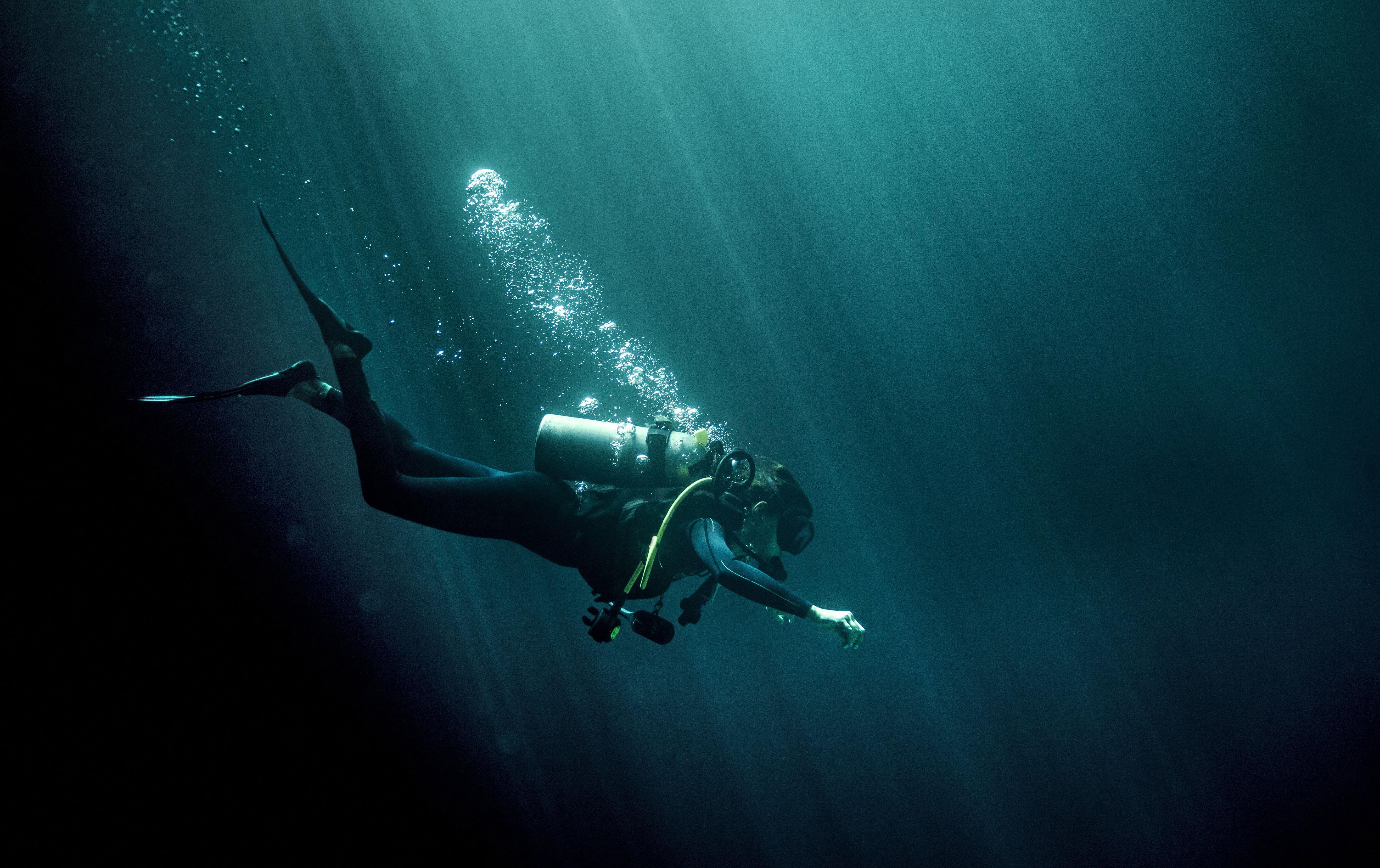 Lone scuba-diver in a dark blue sea