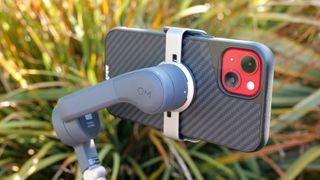 DJI Osmo Mobile 6 with phone mounted via magnetic clamp