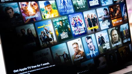 apple tv+ streaming service showing various movies and tv shows on a laptop