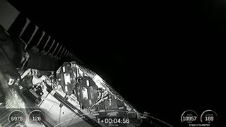 This view from SpaceX's Falcon 9 rocket upper stage shows the 54 upgraded Starlink internet satellites in their stacked configuration after launching into orbit on Dec. 28, 2022.