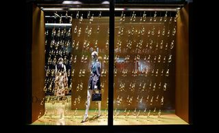 Hundreds of Dior perfume bottles raining down