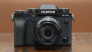 The Fujifilm X-T5 camera sitting on a table