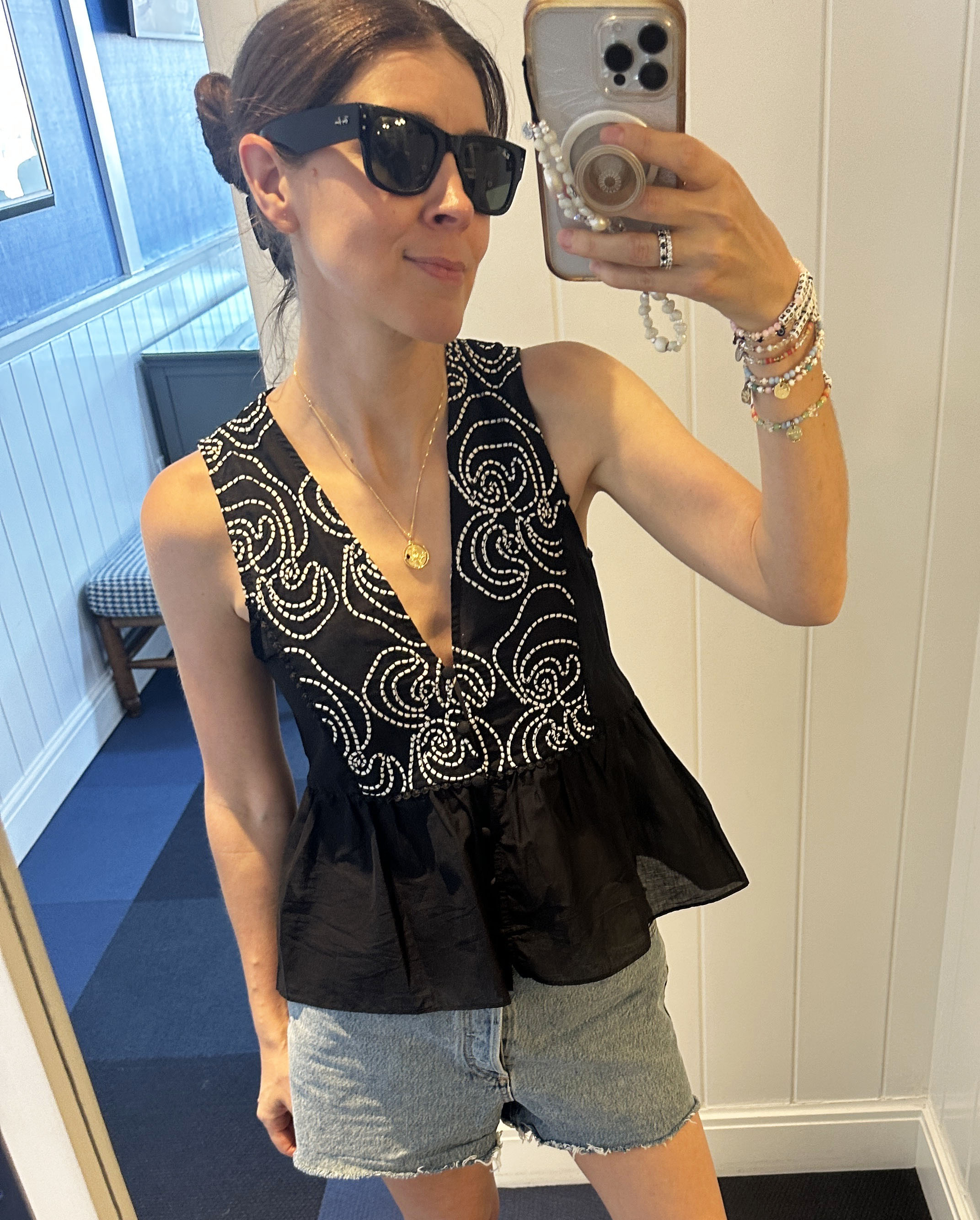 Woman in black and white top and jeans