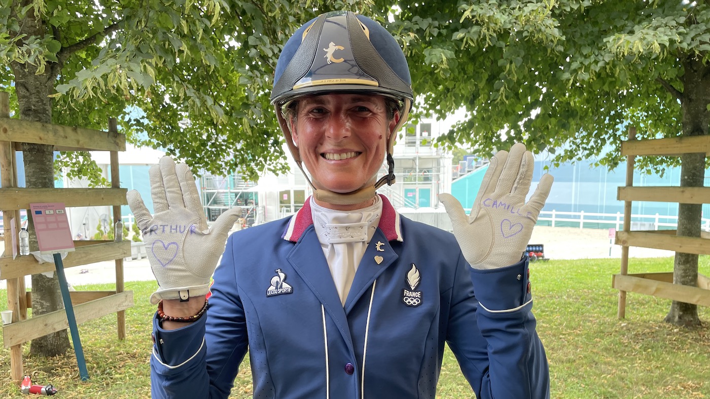 Olympic dressage Pauline Basquin with children's names on her gloves