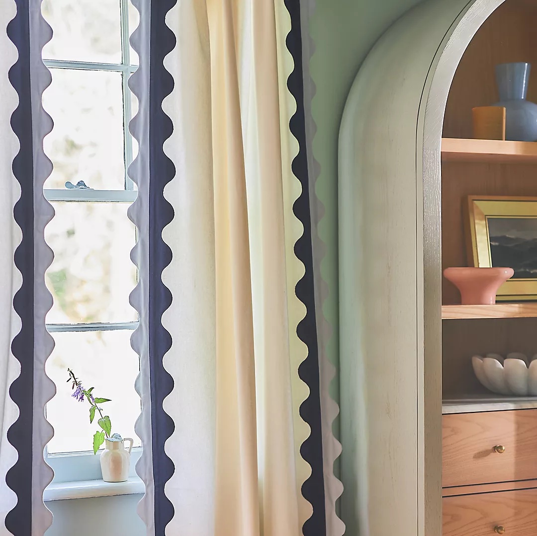 blue and white scalloped print curtain by anthropologie