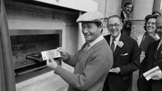 Reg Varney using the first cash machine