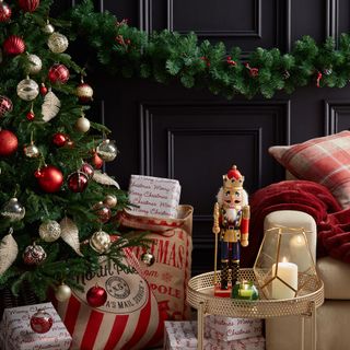 room with christmas tree gift boxes and nutcracker decorations