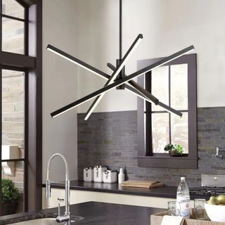 An abstract chandelier light in a bright kitchen