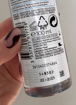 A close up of the back of a La Roche-Posay product to show the skincare expiry date information and symbols