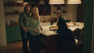 the morgan family played by ray romano lisa kudrow and chloe east sitting around a kitchen island in no good deed