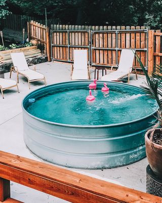 stock tank pool in backyard