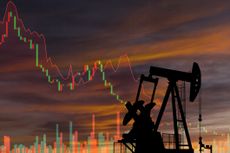 an oil rig against a background with a down-trending stock chart