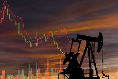 an oil rig against a background with a down-trending stock chart
