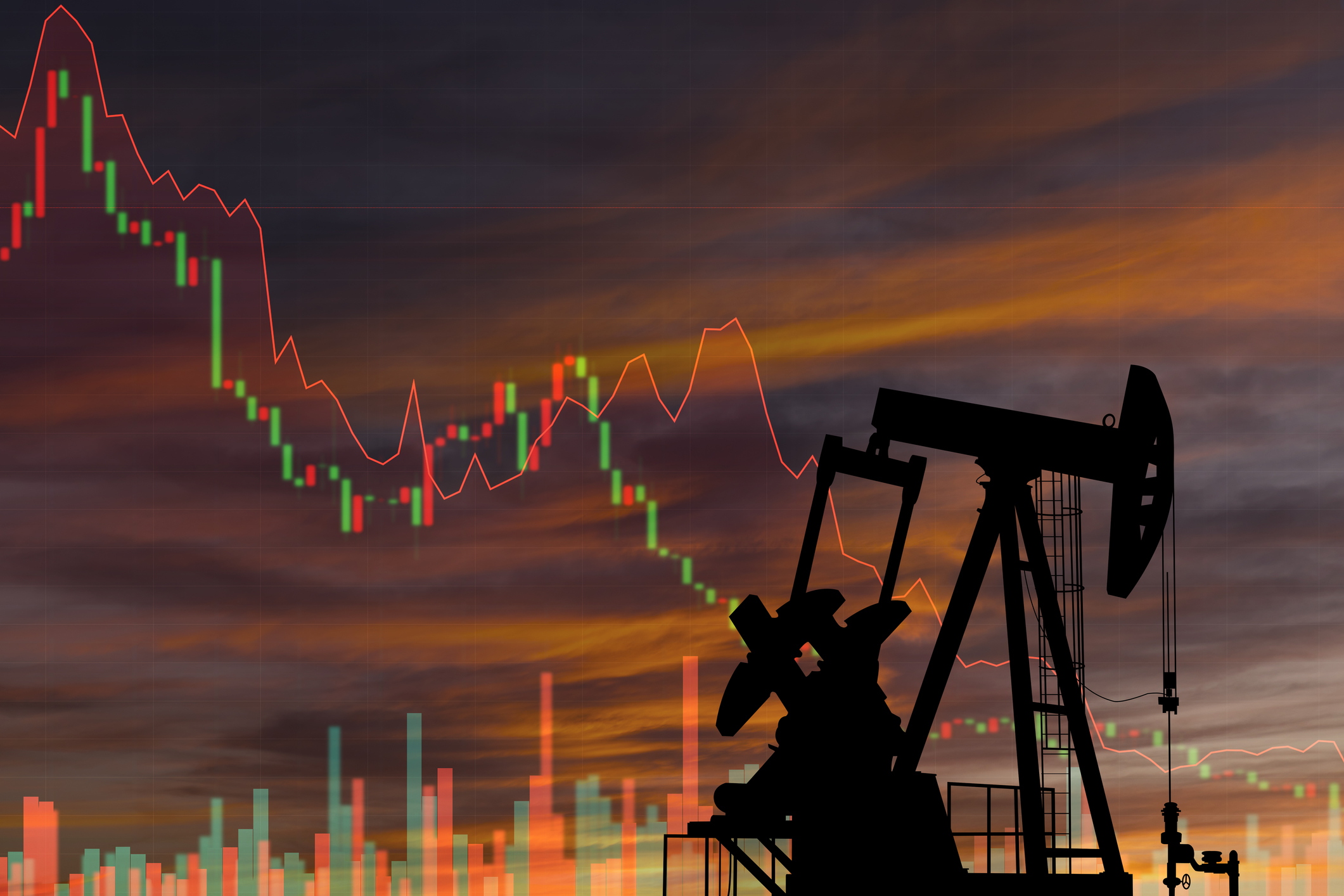 an oil rig against a background with a down-trending stock chart