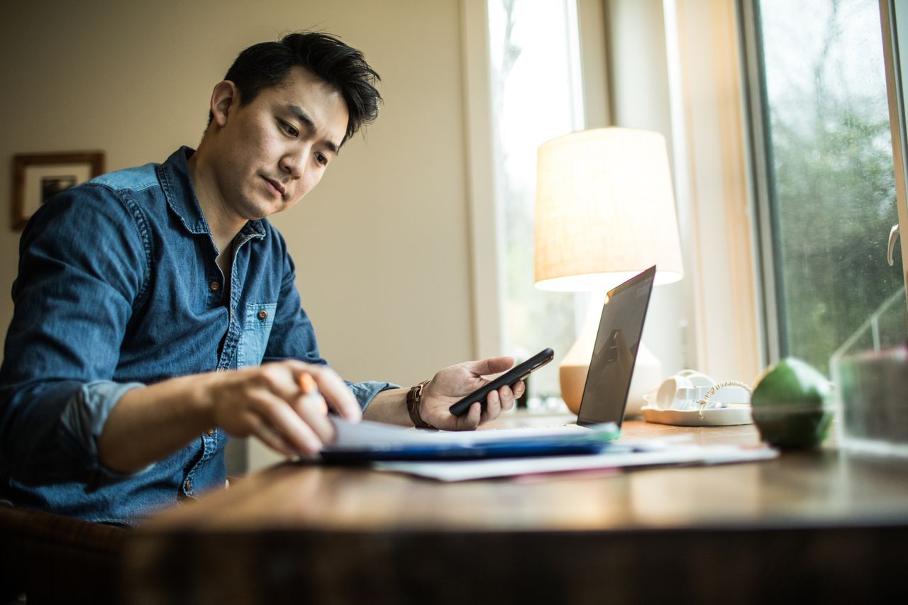 Man looks at laptop