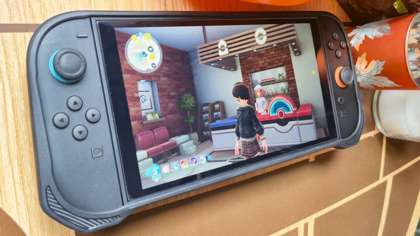 Photo of a Switch 2 sitting in the Spigen Rugged Armor case while sitting on a wooden table.